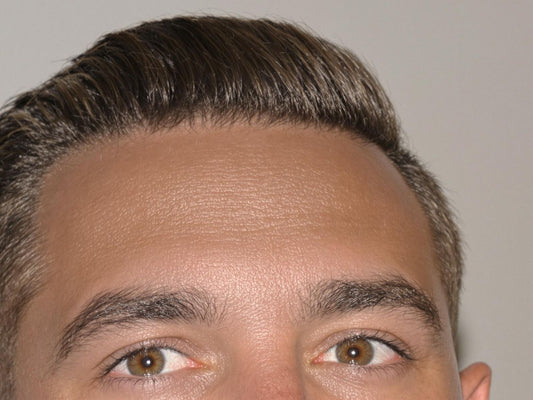 Man with stylish haircut for receding hairline.