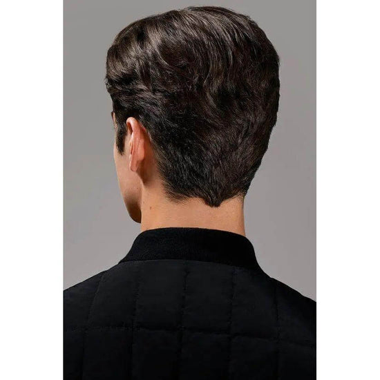 Man with styled hair from the back showcasing Oribe Crème For Style's natural texture and shine