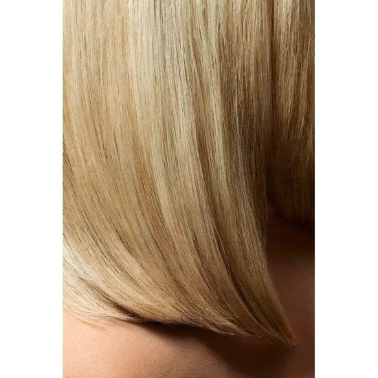 Silky blonde hair styled with Oribe Crème For Style, showcasing smooth texture and natural shine.