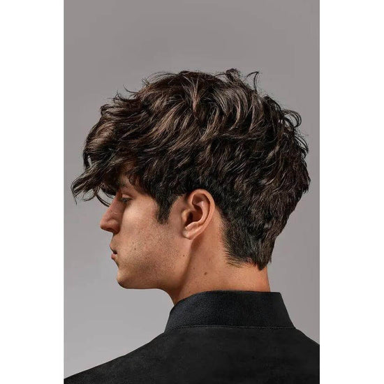 Man with textured hair styled using Oribe Flash Form Finishing Spray Wax for a natural matte finish