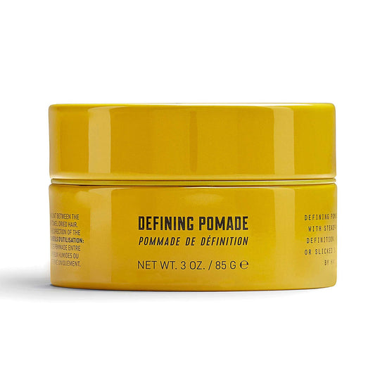 Bright yellow container of Lock Stock & Barrel's Defining Pomade 85g for strong yet flexible hair hold and natural shine.