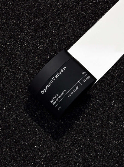 Organised Confusion Texturizing Hair Paste for men on black background