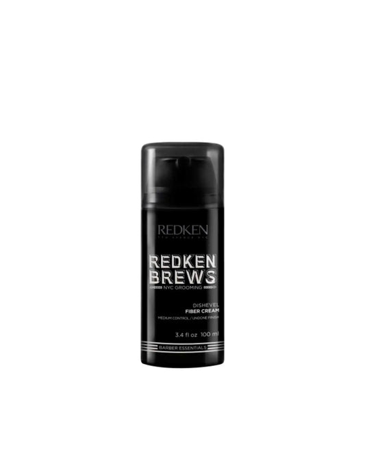 Redken Brews Dishevel Fiber Cream for men, offering flexible hold and a natural textured look in a black 3.4 fl oz container.