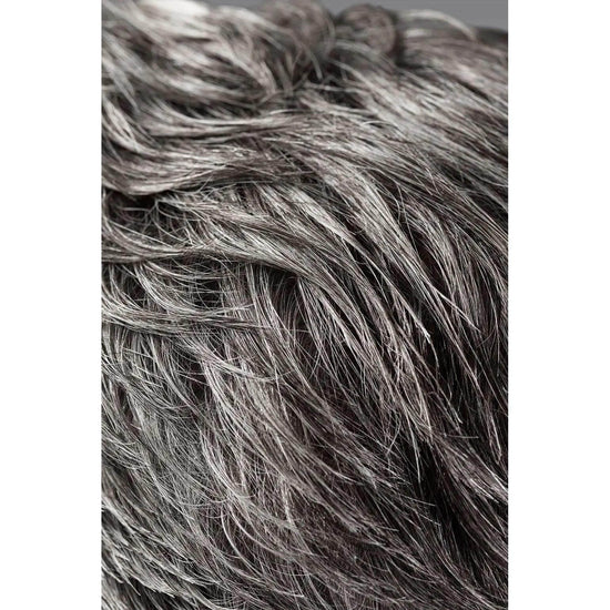 Close-up of textured tousled hair styled with Oribe Rough Luxury Soft Molding Paste