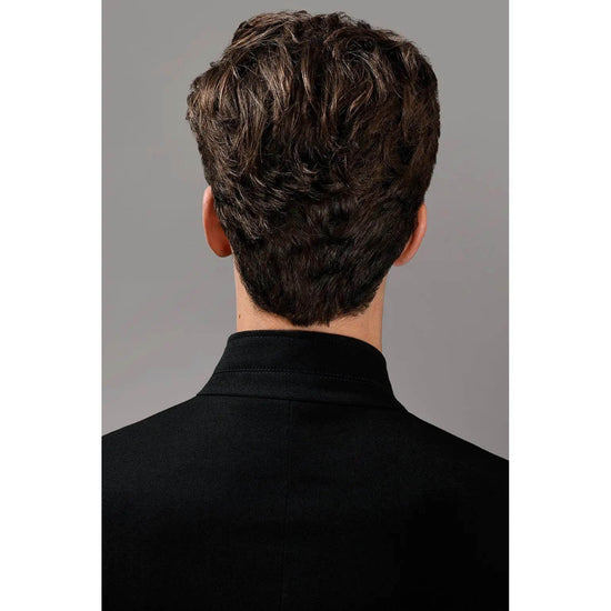 Back view of a man with styled hair using Oribe Rough Luxury Soft Molding Paste for a controlled and flexible hold.