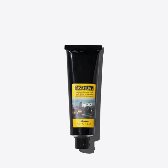 Davines Styling Paste tube offering high-performance hold with a natural finish, versatile for any hairstyle, enriched with natural ingredients